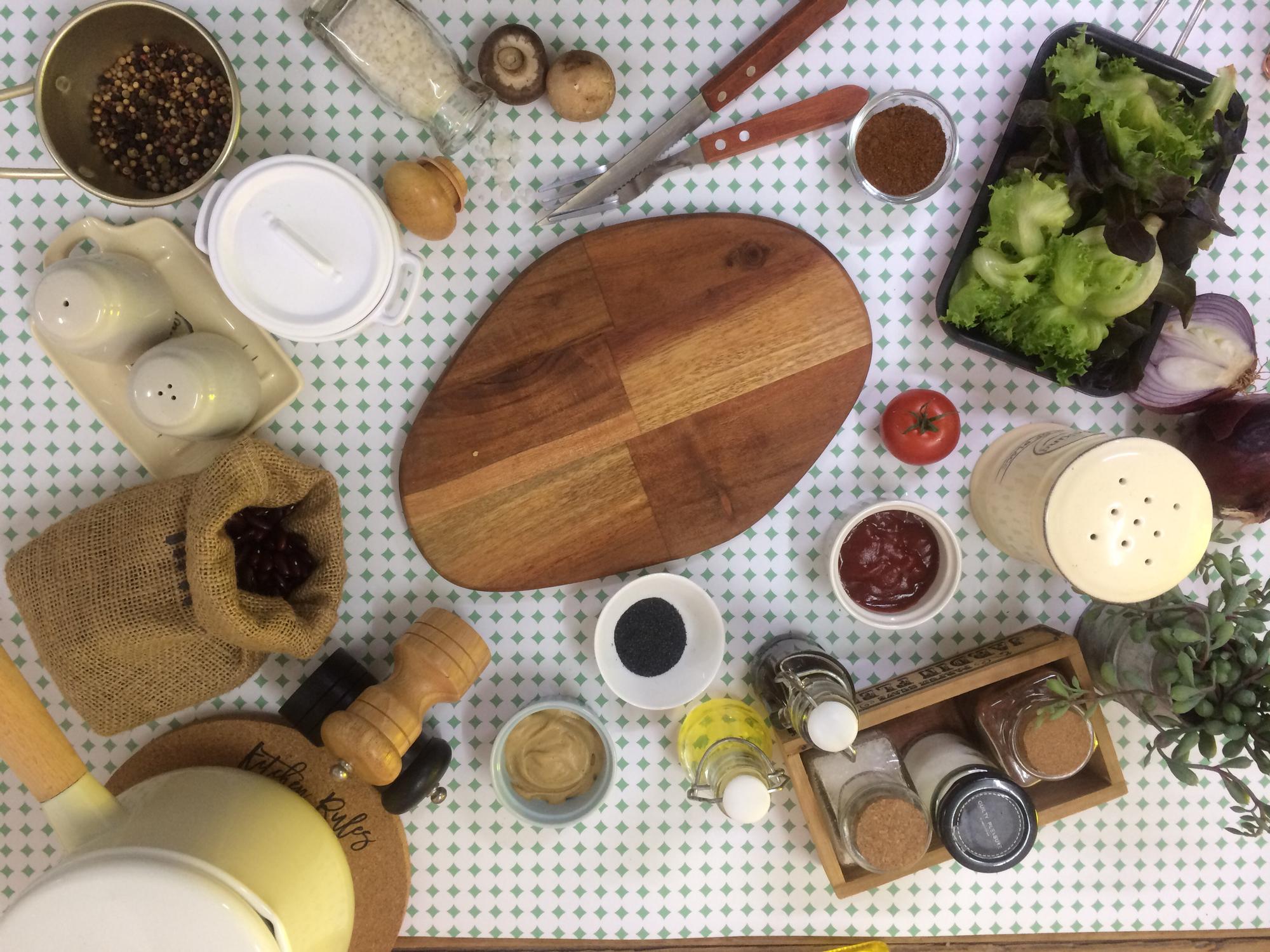 Workshop table with bowls, herbs and tools