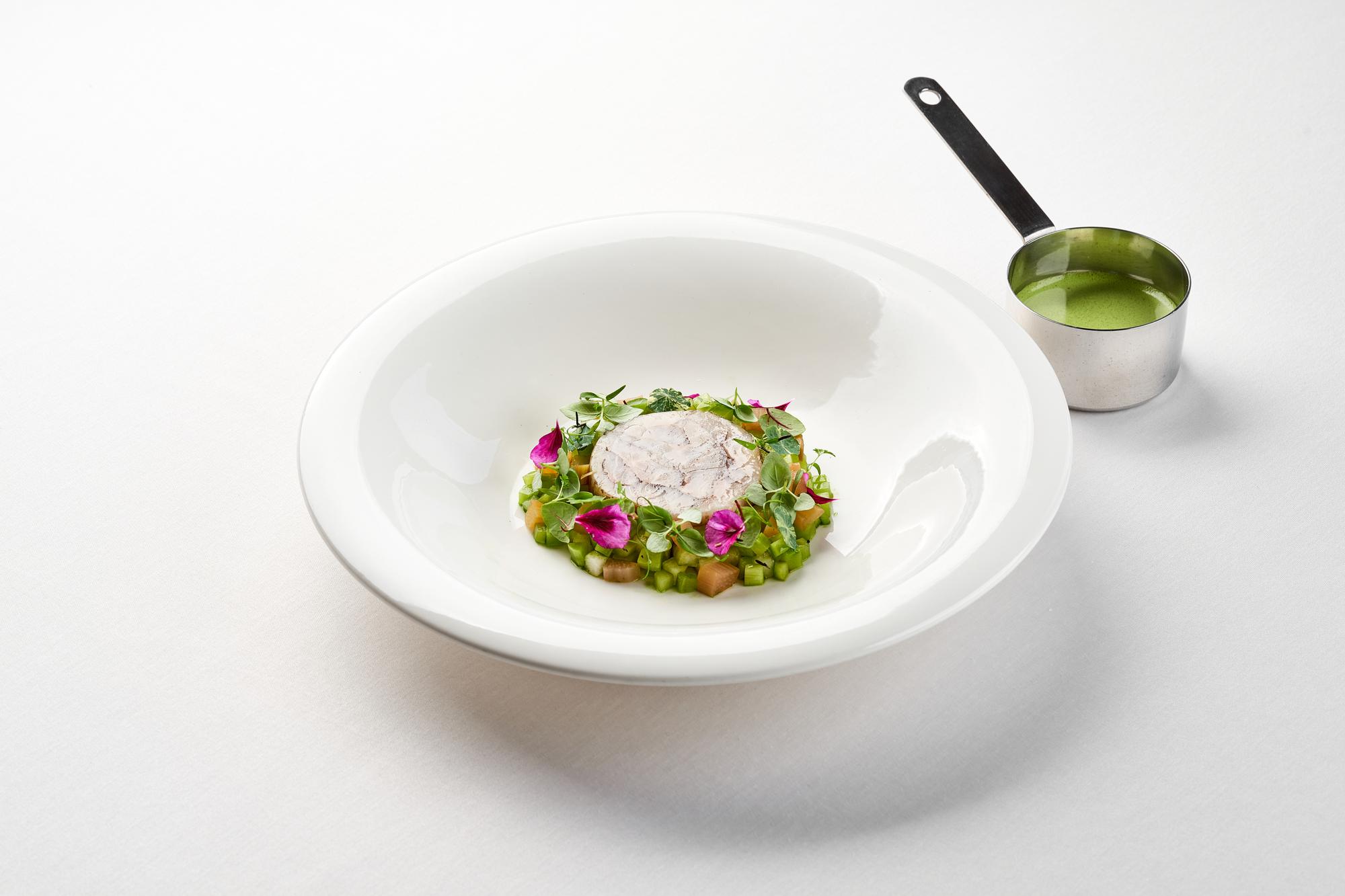 Plated starter with herb garnish